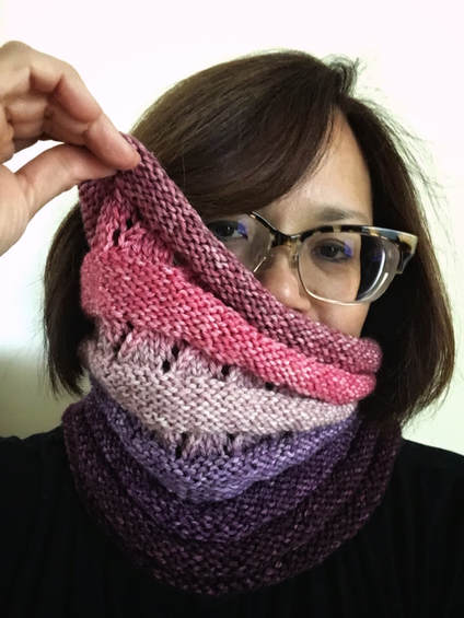Pink and purple hand knit cowl modeled by knit designer PDXKnitterati.